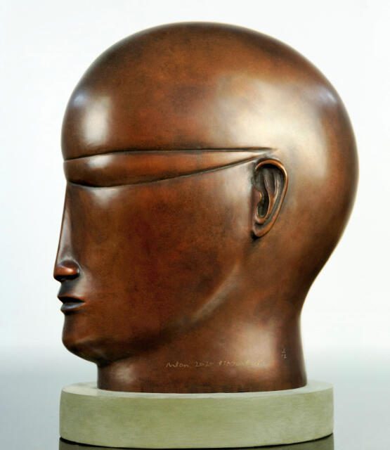 Black head with glasses small brown sculpture by artist Anton Smit